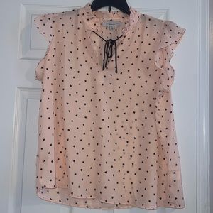Pink blouse with black hearts